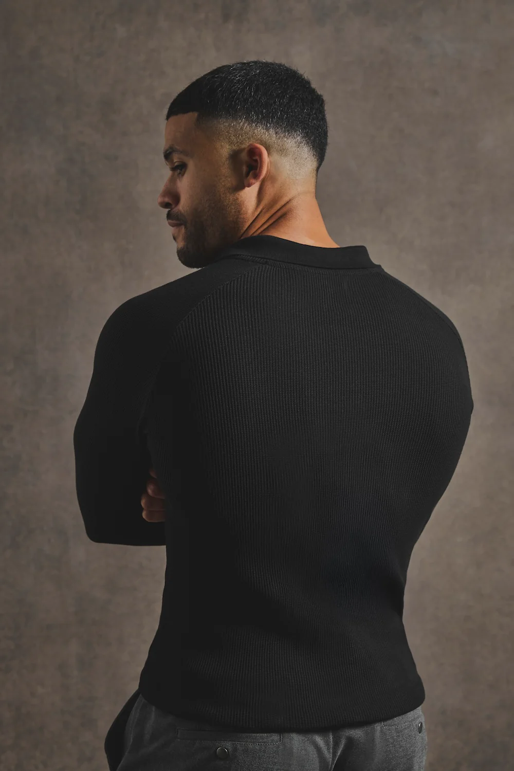 Textured Buttonless Polo Shirt in Black - Image 7